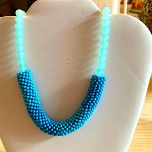 Light turquoise beads with darker seeded necklace.    24” long elastic